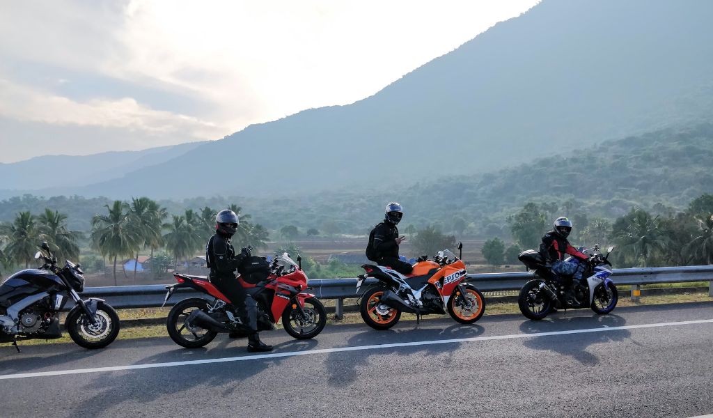 Why do motorcyclists travel in groups?